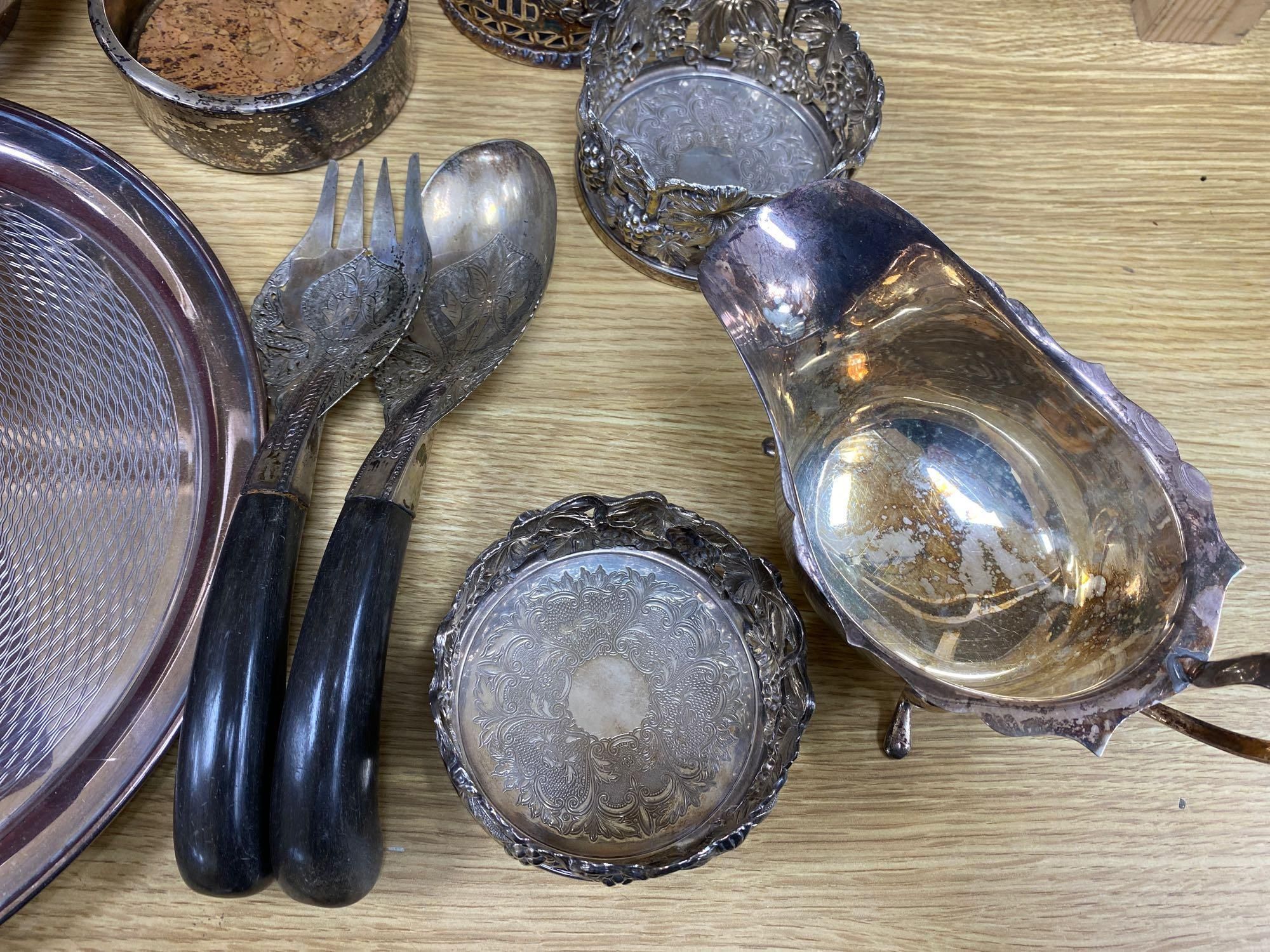 A quantity of plated items including coasters, flatware, cream jug, etc.